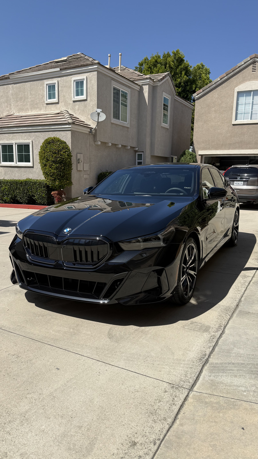Black BMW 5 Series sedan after ceramic coating